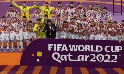 Croatia’s players celebrate with medals after winning the Qatar 2022 World Cup football third place play-off match between Croatia and Morocco